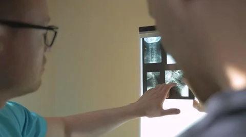 Doctor is showing something on the x-ray. Stock Footage 62948783