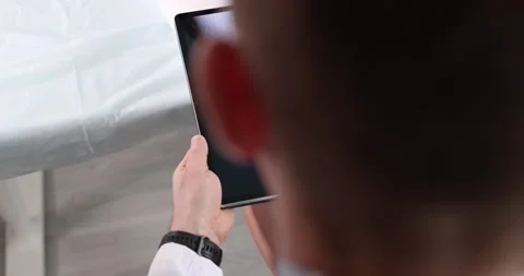 Doctor shows knee joint image during patient health consultation Stock Footage 317162389