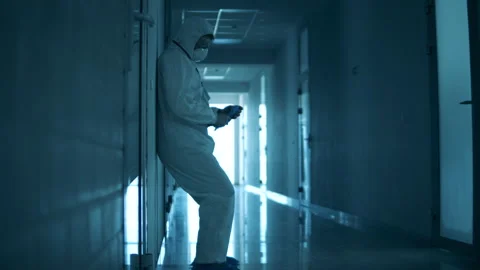 Doctor is sliding down the wall while being exhausted Stock-Footage 130641933