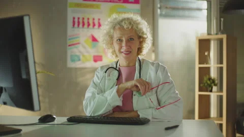 Doctor smiling and looking at camera Stock Footage 221265241