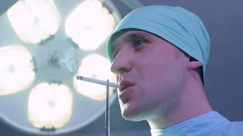 Doctor Smoking in Operating Room Stock Footage 59061760
