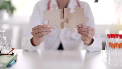 Doctor solving a problem and searching for the right treatment. Stock Footage 260233295