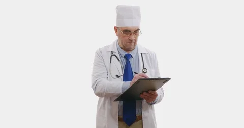 Doctor standing uses tablet computer, close up, 6k. Isolated on white. Stock Footage 128549911