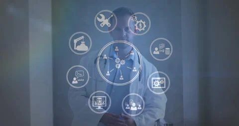 Doctor standing while gear icons appearing and forming rotating health network Stock Footage 311697546