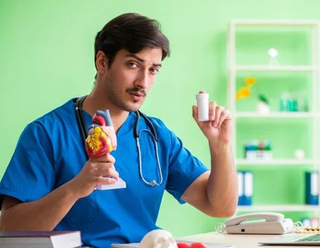 Doctor student explaining heart problems Stock Photos