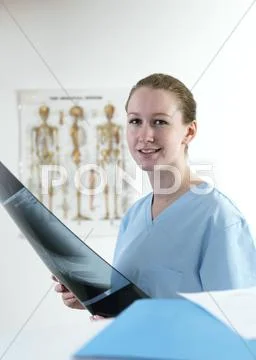 Doctor Studying An X-Ray