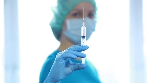 Doctor with a syringe. Stock Footage 82854219