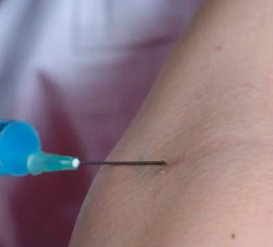 Doctor with syringe Stock Photos
