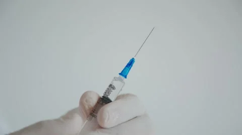 Doctor with syringe is preparing for injection Stock-Footage 55958359