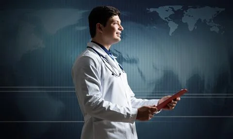 Doctor with tablet Stock Photos