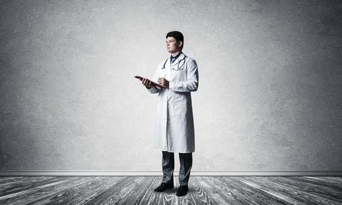 Doctor with tablet Stock Photos