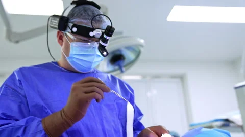 Doctor takes the bandages using forceps. Stock Footage 234351491