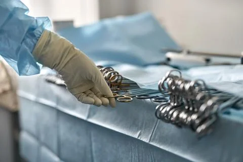 Doctor is taking forceps Foto stock