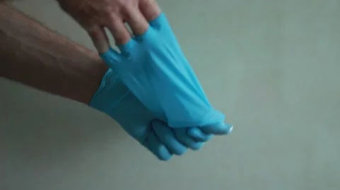 Doctor taking off gloves 動画素材 63455963