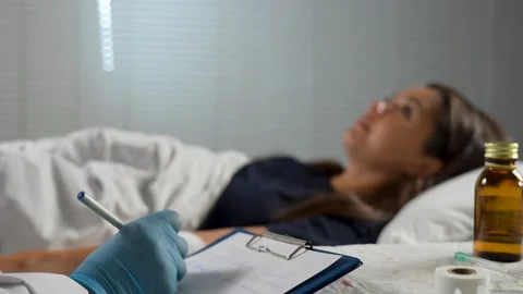 Doctor Taking Notes During Patient Check-up Stock Footage 314765976
