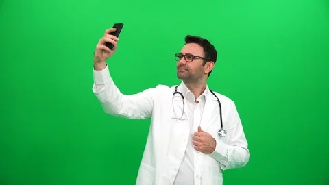 Doctor Taking Selfie on Green Screen Stock Footage 88652124