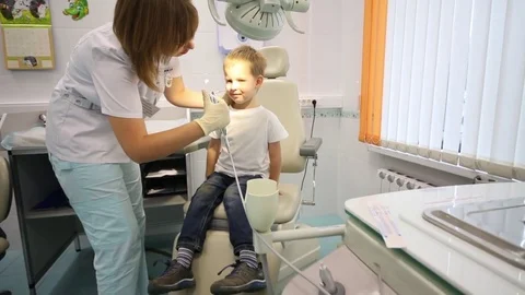 Doctor is taking tool with Normal saline solution from ENT station Stock Footage 76701688