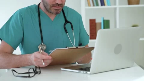 Doctor talking to client using virtual chat showing medical reports Stock Footage 170033781