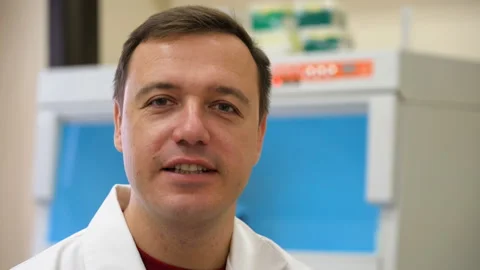 Doctor talking look camera biomedical laboratory. Scientist in laboratory and Stock Footage 168515224
