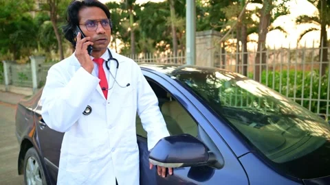 Doctor talking with mobile next to cat Stock Footage 278022788