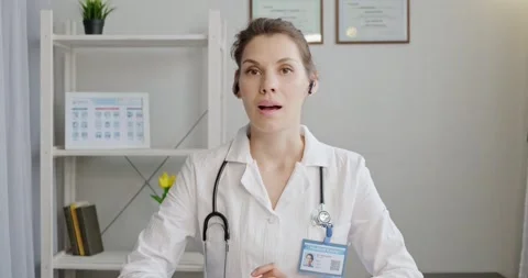 Doctor talking to patient using virtual chat computer app. Female medical Stock Footage 135237362