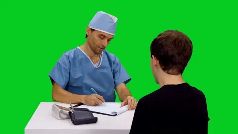 Doctor talking to patient while being at appointment against green screen 스톡 동영상 126339857