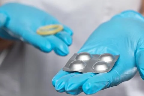 The doctor talks about the methods of contraception. It contains a condom a.. Stock Photos