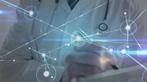 Doctor tapping tablet screen and mapping medical data network expanding across Stock Footage 312842237