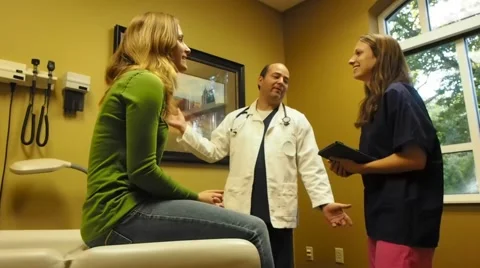 Doctor teaching assistant in the office Video stock 56354297
