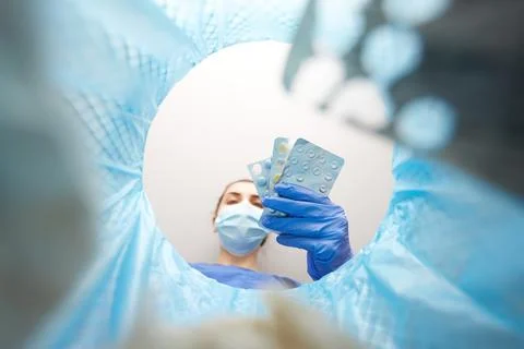 Doctor throwing medicine pills into trash can Stock Photos