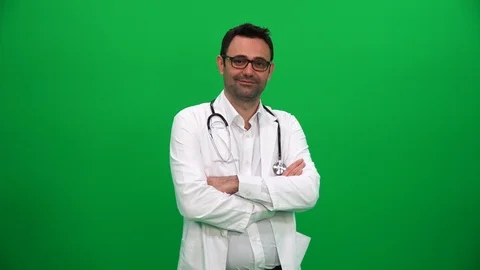 Doctor Turning and Looking at Camera on Green Box Background Stock Footage 88652272