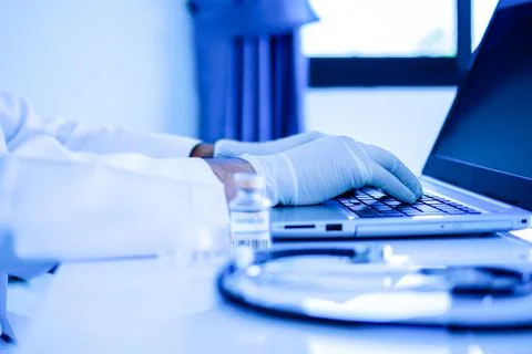 A doctor typing the data and description into a server computer Stock Illustration