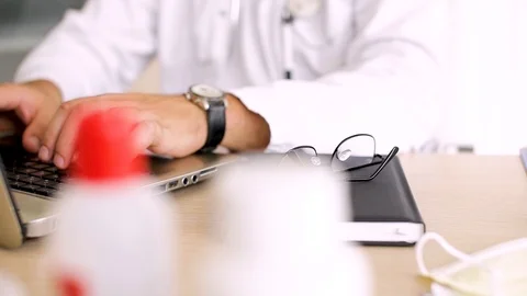 Doctor Typing On Laptop Video stock 87767203