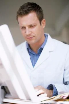 Doctor typing notes Foto stock