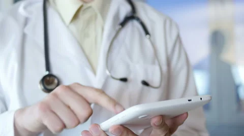 Doctor Typing On Tablet Stock Footage 64062560