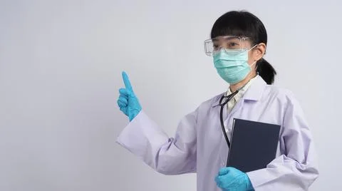Doctor in uniform points to an empty area. Hand gesture. Stock Photos