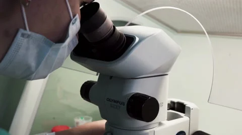 Doctor use microscope for blood analysis at modern medical laboratory Stock Footage 59520173