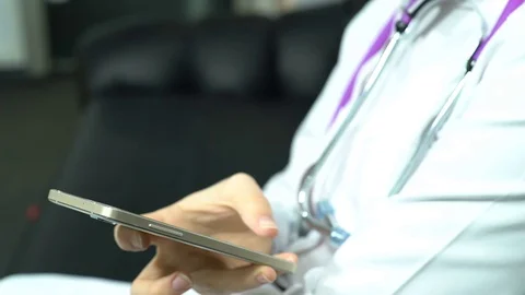 Doctor Use Smart Phone Computer and Controlling X-Ray Stock Footage 74527177