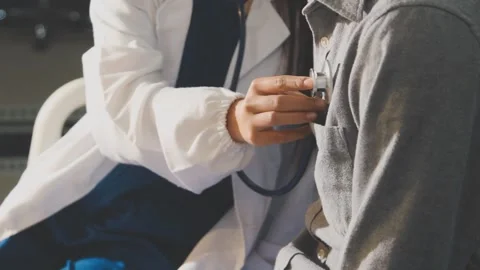 Doctor use stethoscope, checking up heart beat, auscultation in doctor offi.. Stock Footage 343709010