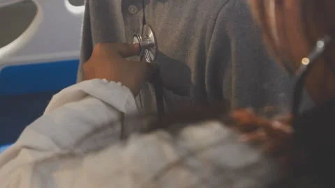 Doctor use stethoscope, checking up heart beat, auscultation in doctor offi.. Stock Footage 343709392