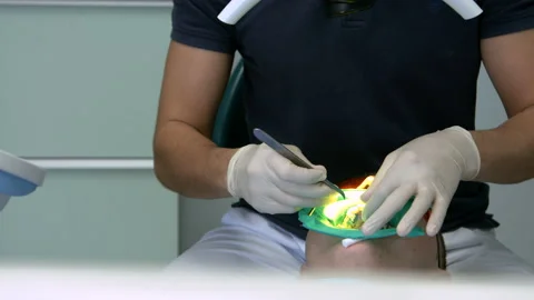 Doctor Used Microscope. Dentist Is Treating Patient In Modern Dental Office Stock Footage 94381630