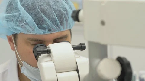 Doctor used microscope. Dentist is treating patient in modern dental office Video stock 120800208