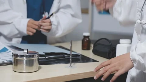 Doctor uses anatomical model to explain male urinary system. Model labeled .. Stock Footage 332664532
