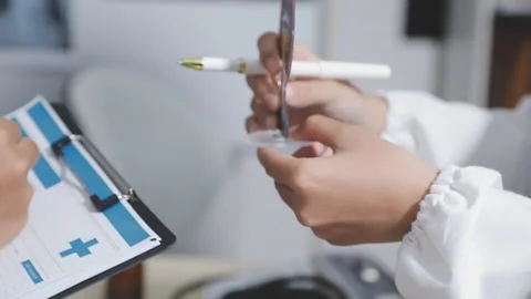 Doctor uses anatomical model to explain male urinary system. Model labeled .. Stock Footage 332664582