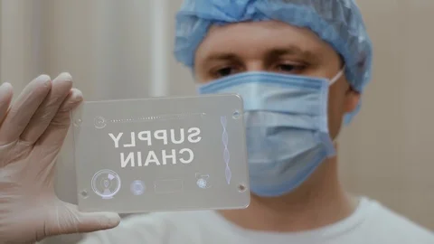 Doctor uses tablet with text Supply Chain Stock Footage 112056396