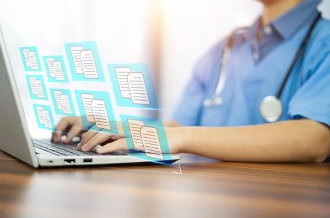 Doctor using computer Document Management System (DMS), online documentatio.. Stock Photos