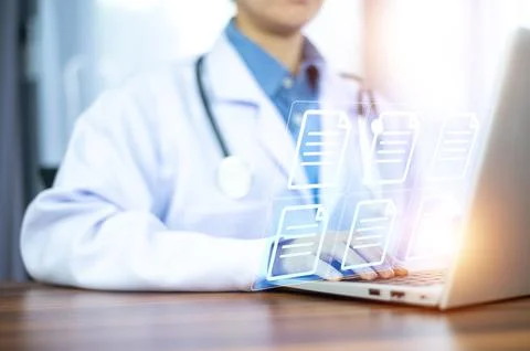 Doctor using computer Document Management System (DMS), online documentatio.. Stock Photos