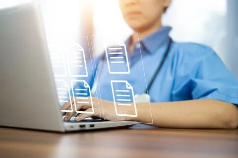 Doctor using computer Document Management System (DMS), online documentatio.. Stock Photos