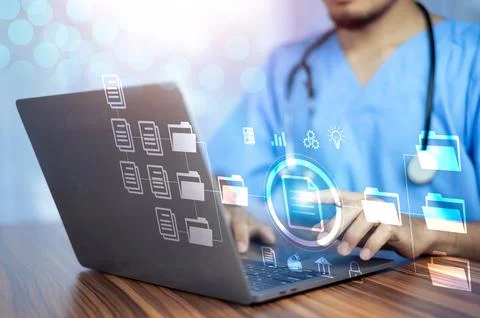 Doctor using computer Document Management System (DMS), online documentatio.. Stock Photos