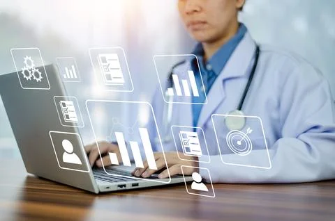 Doctor using computer Document Management System (DMS), online documentatio.. Stock Photos